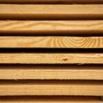 Close-up view of stacked hardwood planks ready for carpentry or construction use.